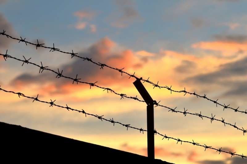 Barbed wire fence. Credit: PIMPUN TAWAKOON/Shutterstock.