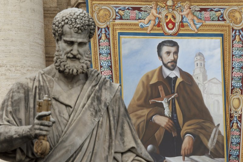 A tapestry of St. John of Avila hangs from the facade of St. Peter's Basilica before the opening Mass of the Synod of Bishops on the new evangelization celebrated by Pope Benedict XVI in St. Peter's Square at the Vatican Oct. 7
