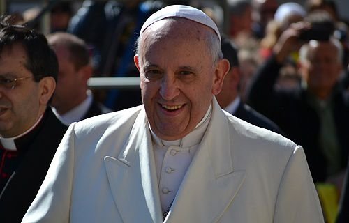 Pope Francis greets pilgrims in St. Peter's Square before the Wed. general audience on April 16