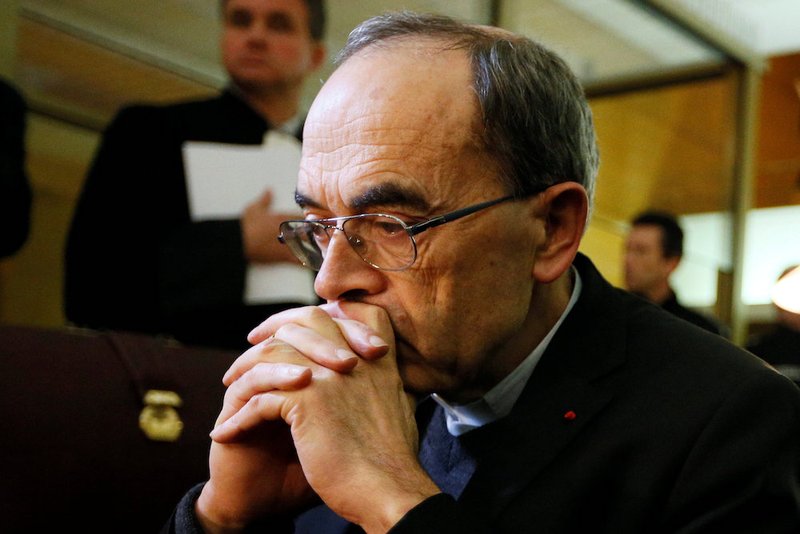 French Cardinal Philippe Barbarin of Lyon pauses at the courthouse Jan. 7 in Lyon. Cardinal Barbarin and others are on trial for failing to discipline a local priest who allegedly abused children while running a Scout group in the 1980s. (CNS photo/Emmanuel Foudrot)