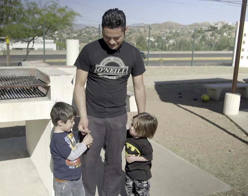 Adrian Quiroz  with his two sons. (Casey McCorry/Angelus News)