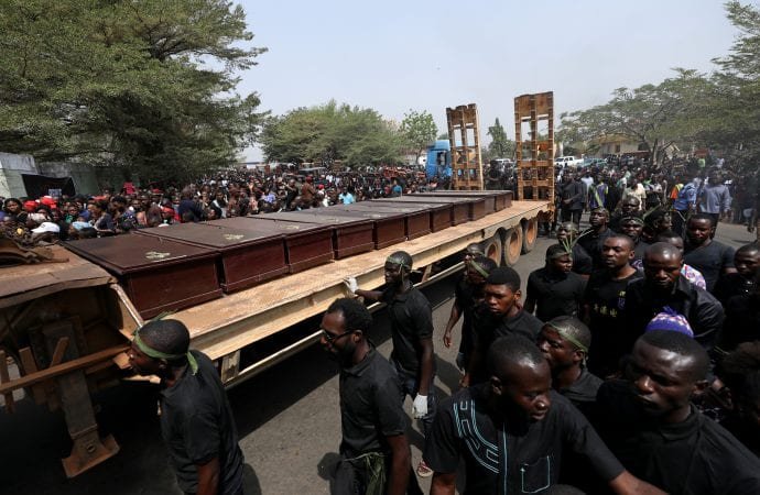 Men march along a truck Jan. 11
