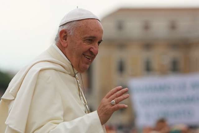 Pope Francis greets pilgrims during his general audience June 24