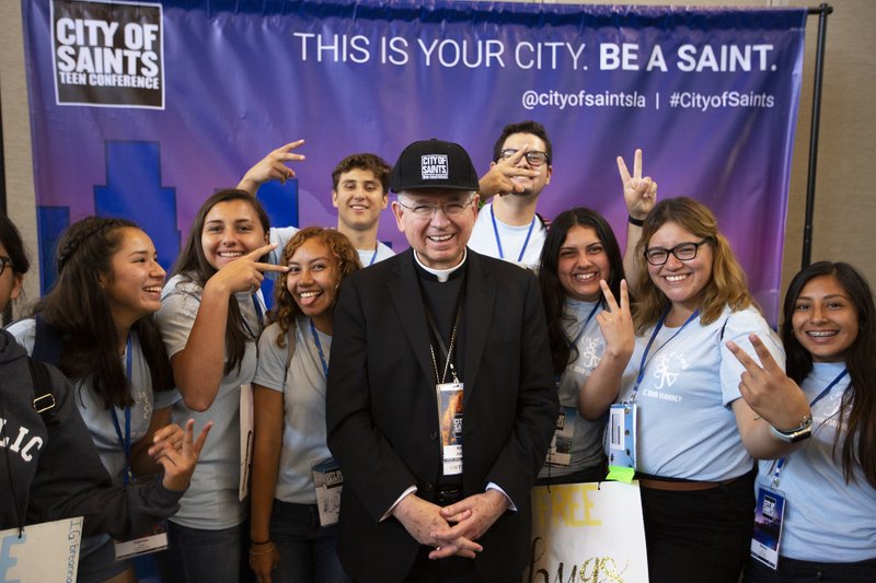 Teens from St. John Vianney in Hacienda Heights pose with Archbishop Gomez at the City of Saints photo booth in 2019. (Victor Alemán)