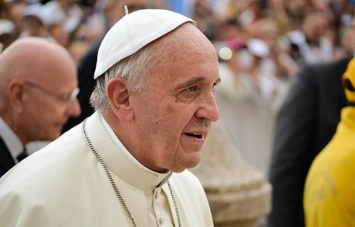 Pope Francis greets pilgrims in St. Peter's Square before the Wednesday general audience on June 25