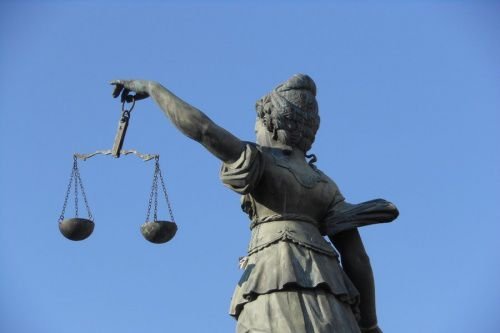 Scales of Justice. Credit: Michael Coghlan via Flickr (CC BY-SA 2.0).