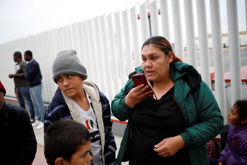 Asylum seeker Antonia Portillo Cruz speaks on the phone in Tijuana