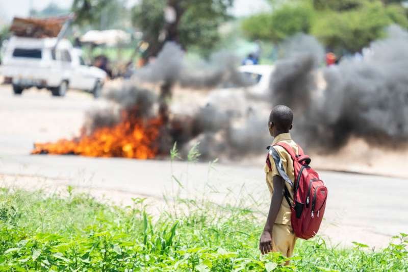 Protesters in Zimbabwe barricaded roads with burning tires after the government more than doubled the price of fuel January 2019. Credit: Zinyange Auntony / AFP / Getty Images.