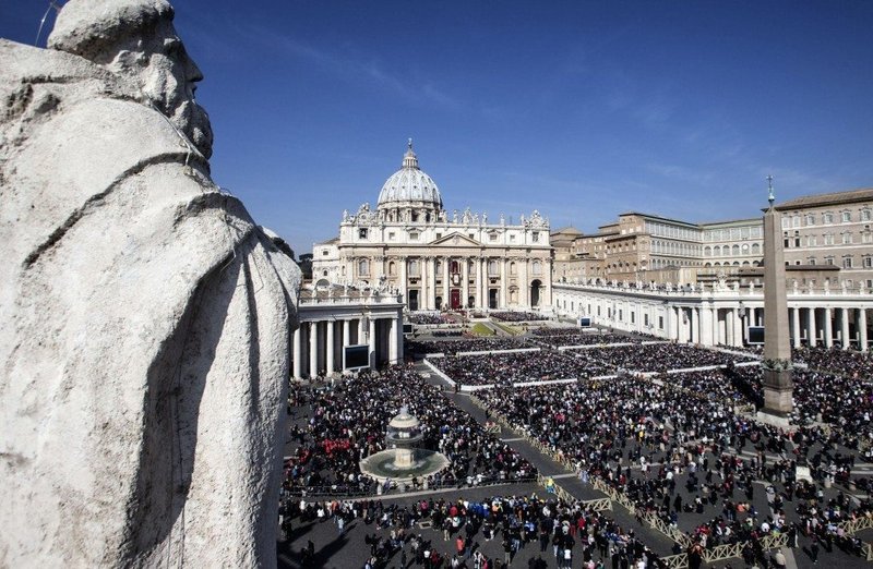 Faithful crowd the square during the Easter Holy mass celebrated by Pope Francis in St. Peter's Square at