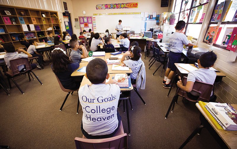 Third-grade teacher Adela Dinwiddie’s class at St. John the Evangelist Catholic School in Tucson