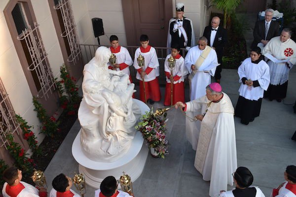 Bishop Edward W. Clark blesses the casting of Michelangelo's Pieta placed at St. John Chrysostom Parish in Inglewood.