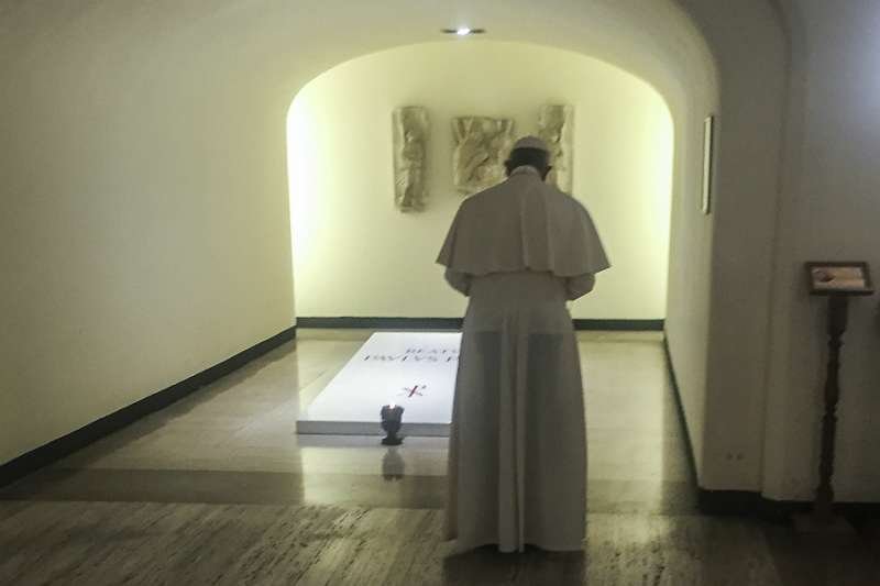 Pope Francis prays at the tomb of Bl. Paul VI beneath St. Peter's Basilica