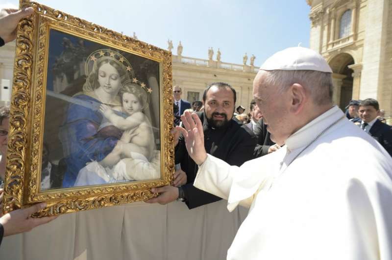 Pope Francis blesses an image of Mary in St. Peter's Square May 3
