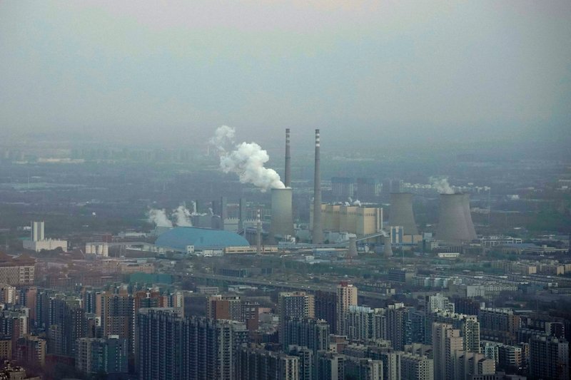 A thermal power plant is seen Nov. 21 near residential buildings in Beijing. As government delegations from across the globe prepare for a Dec. 2-14 U.N. conference on climate change