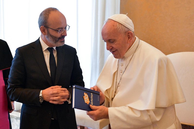 Pope Francis accepts a book during a meeting with members of the Italian National Association of Judges at the Vatican Feb. 9. 2019. (CNS photo/Vatican Media)
