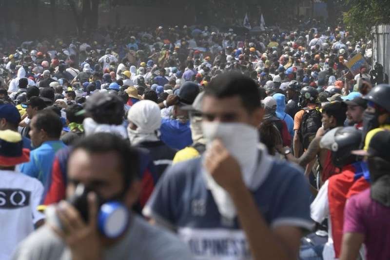 Anti-government protesters take part in a march in Caracas May 1