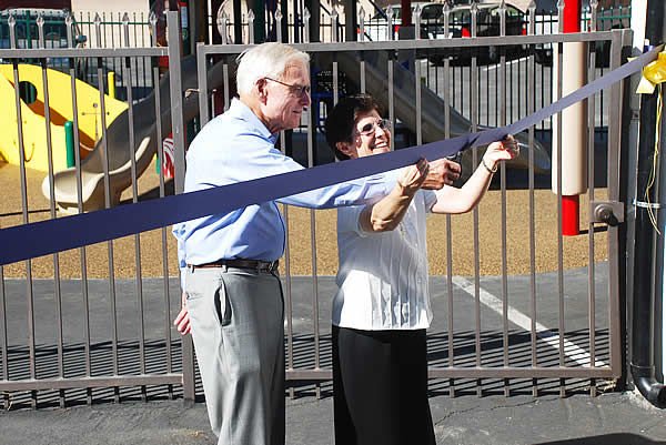 Sister Azucena del Rio assists philanthropist John Shea at the ribbon-cutting ceremony
