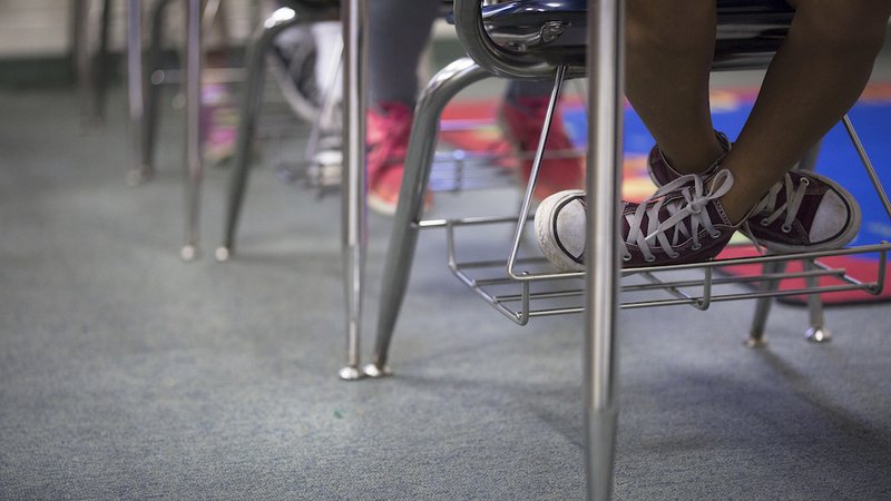 Students sit in Spanish class at Holy Name of Jesus Catholic School in Henderson