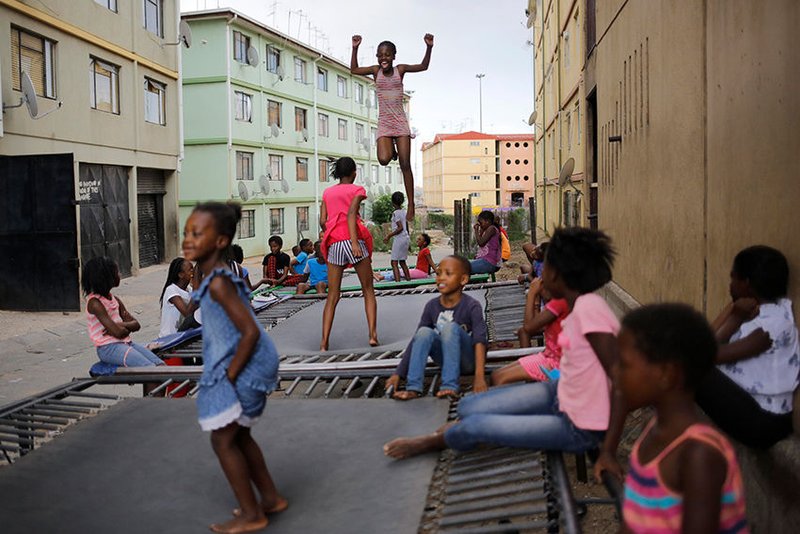 Children jump on a trampolines in 2016 in Johannesburg. Most of Christianity's future growth is likely to be in the global South