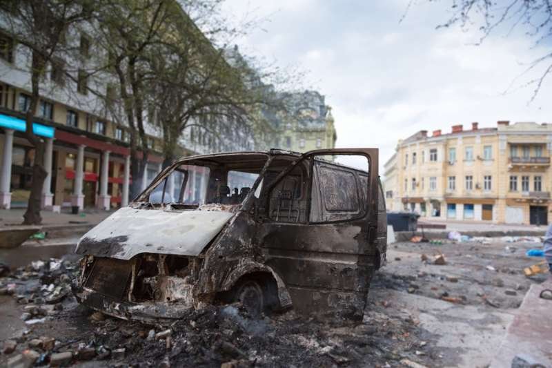Burned car in the center of city after unrest in Odesa