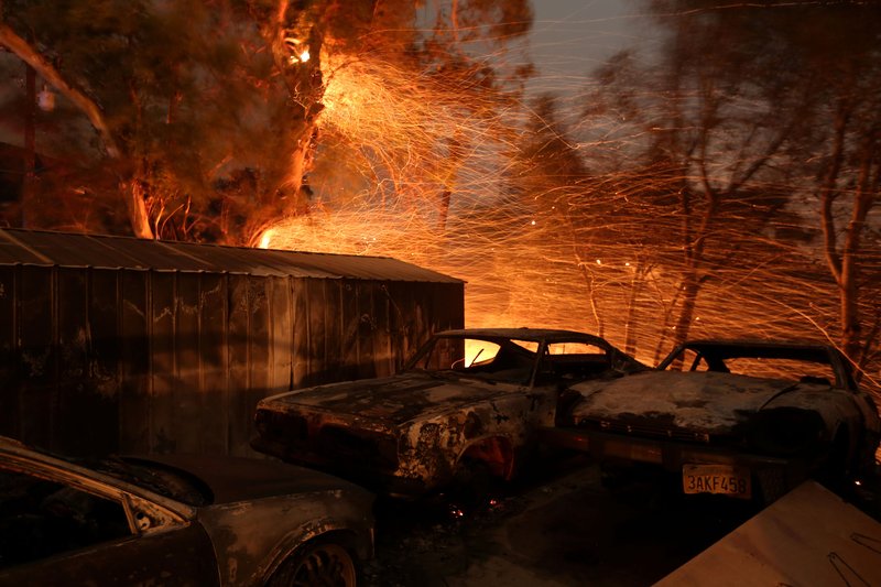 Burned cars are seen on a piece of property Dec. 5 during a wildfire near Santa Paula