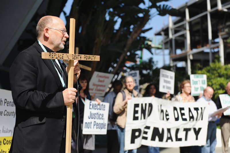 Father Chris Ponnet speaks during a rally protesting the death penalty in Anaheim in 2017. CNS PHOTO/ANDREW CULLEN