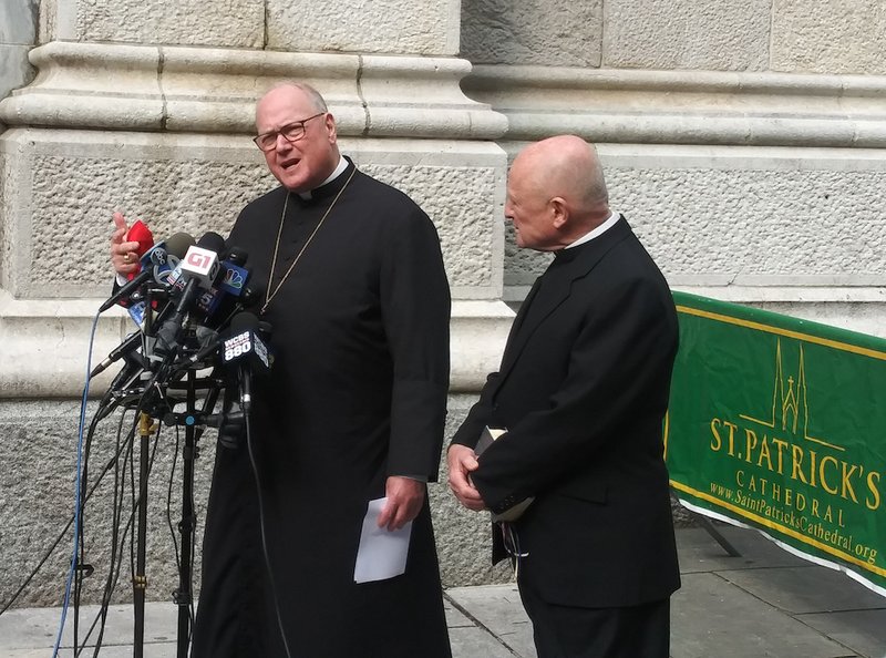 New York Cardinal Timothy M. Dolan speaks to the media outside St. Patrick's Cathedral during a news conference following the devastating fire at Notre Dame Cathedral in Paris April 15