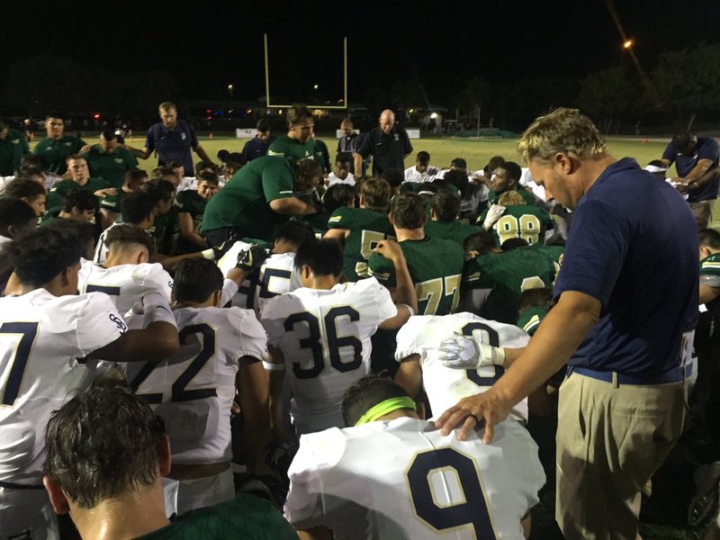 St. John Bosco's football team prays before the game. (PHOTO COURTESY BOSCOFOOTBALL TWITTER)