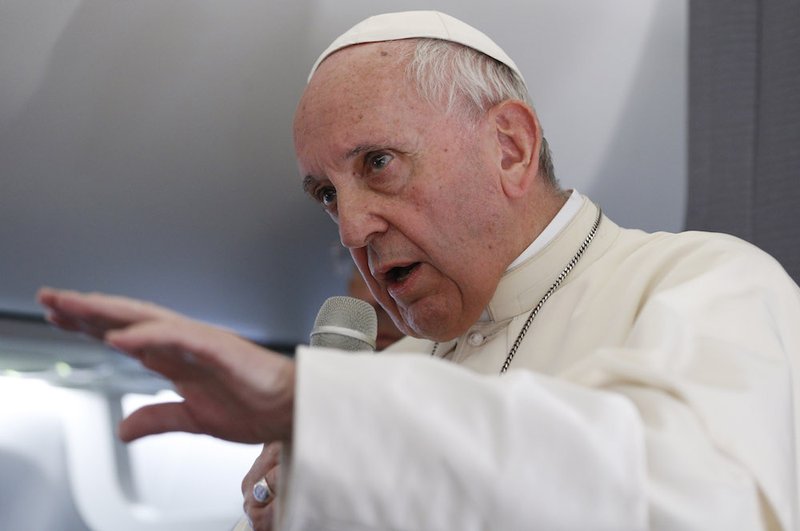 Pope Francis answers questions from journalists aboard his flight from Tallinn