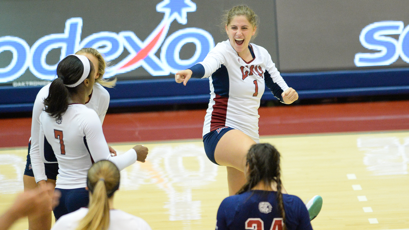 Tess Reid (1) celebrates a point with her LMU teammates at last weekend Kansas Invitational