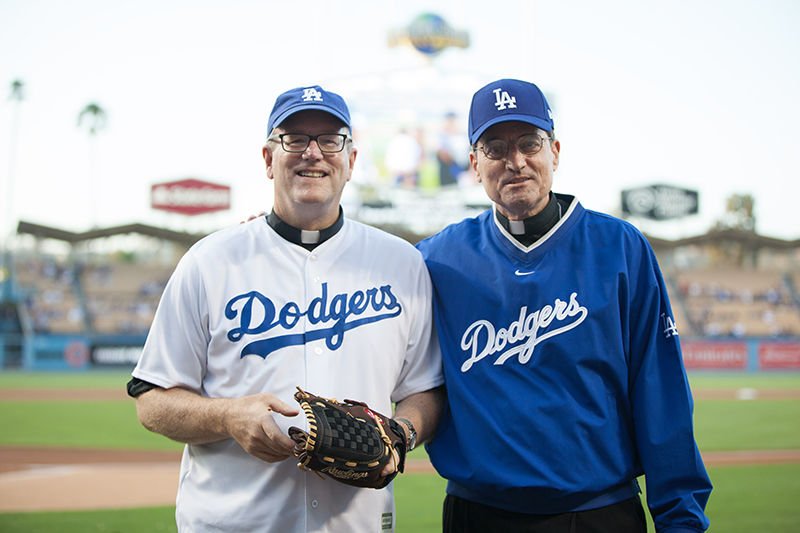 Bishops Robert E. Barron (left) and Joseph V. Brennan take the field at Dodger Stadium the evening of Sept. 2 to throw out ceremonial first pitches. (Photo/Alexandra Cooper)
