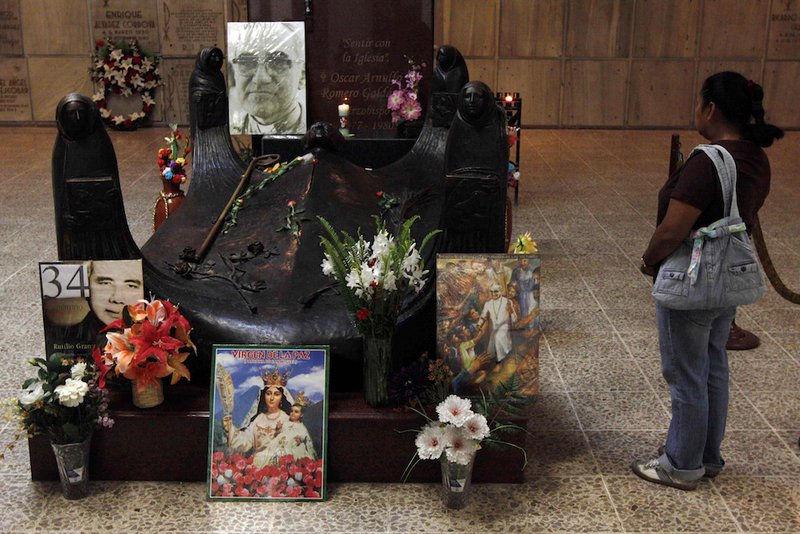 A tourist visits the tomb of Archbishop Oscar Romero in San Salvador