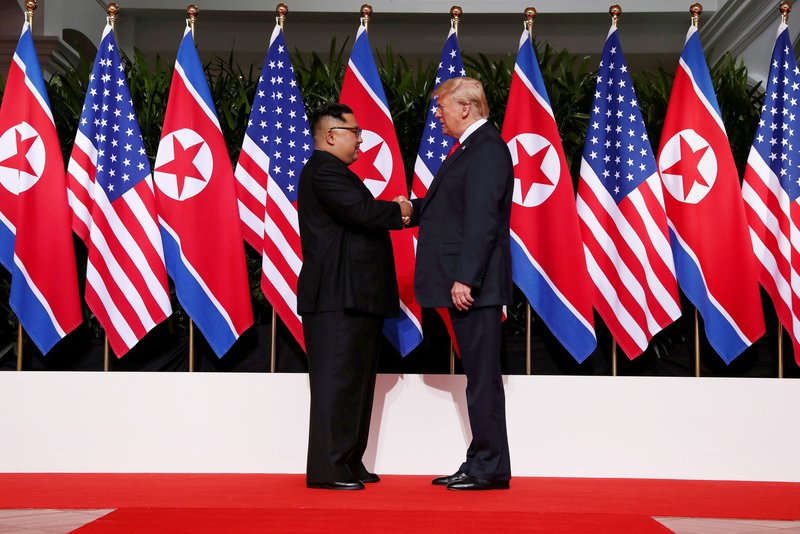 North Korean leader Kim Jong Un shakes hands with U.S. President Donald Trump at the Capella Hotel on Sentosa island in Singapore June 12. Signing a joint statement