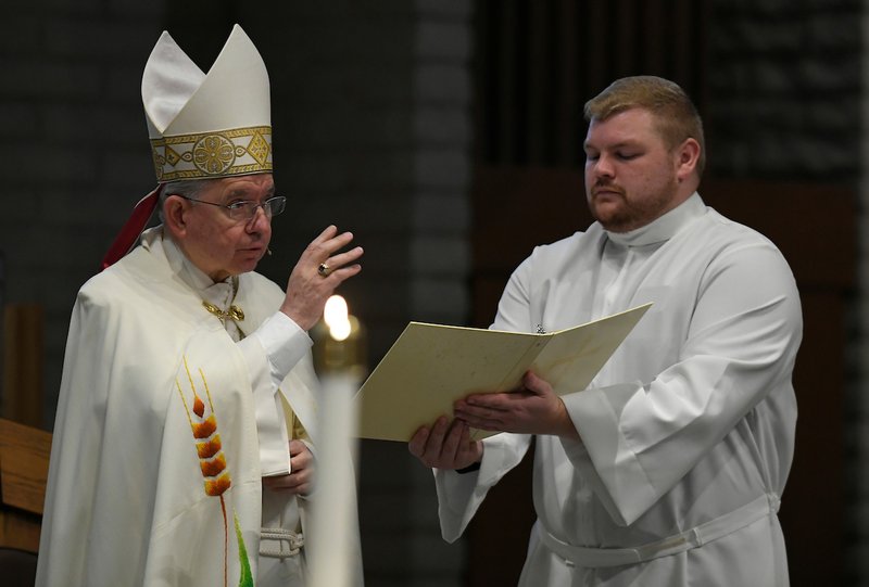 Archbishop Gomez blesses the congregation during a prayer vigil at Saint Paschal Baylon Church on November 8