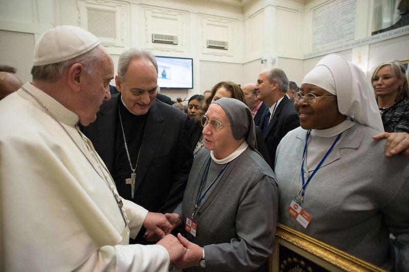 Pope Francis greets Consolata Missionary Sister Eugenia Bonetti in this Dec. 2