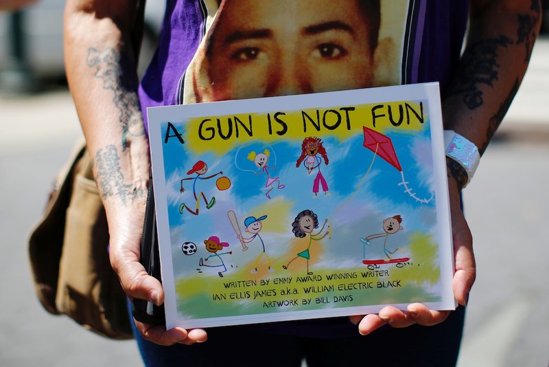 A woman protests the flow of illegal guns in New York City