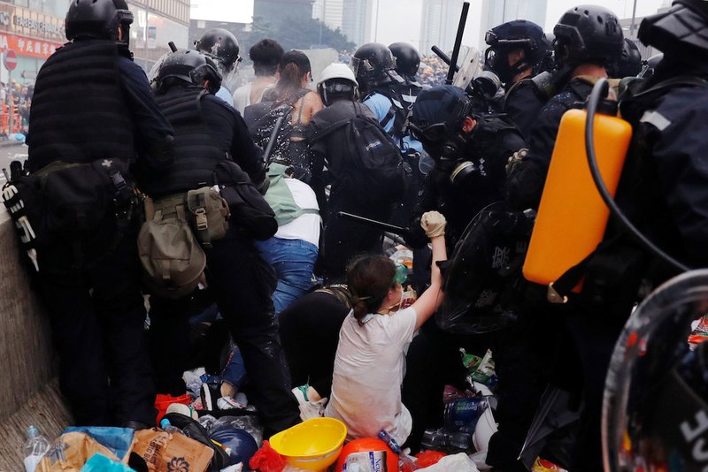 Protesters in Hong Kong clash with riot police June 12