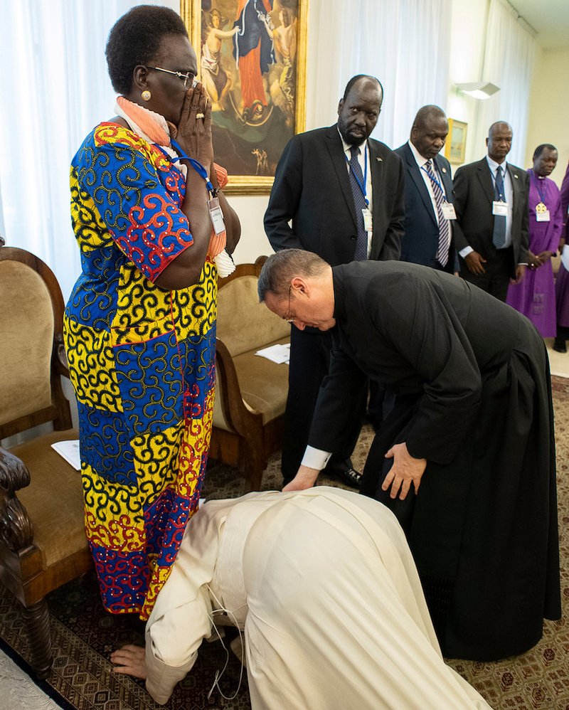South Sudan Vice President Rebecca Nyandeng De Mabior reacts as Pope Francis kneels to kiss her feet April 11