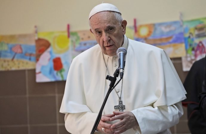 Pope Francis delivers his message during his visit to a refugee center on the outskirts of Sofia