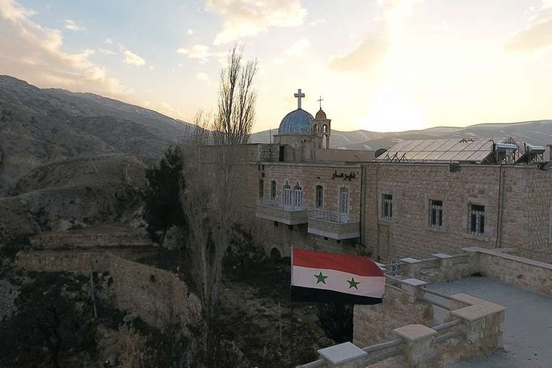 Christian church Iraqi flag (Credit: OBJM/Shutterstock)