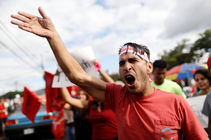 A supporter of Honduran opposition candidate Salvador Nasralla gestures while waiting for official presidential election results Nov. 28 in Tegucigalpa