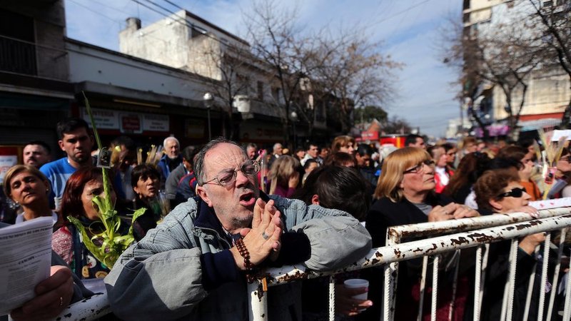 Argentine Catholics pray outside St. Cajetan Church in in Buenos Aires in this 2017 file photo. The Vatican press told reporters in a note Jan. 4 that accusations of sexual abuse against Bishop Gustavo Zanchetta
