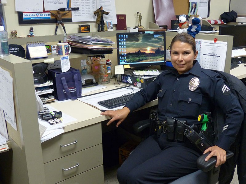 Senior lead officer Gutierrez takes a break in her cubicle. (photo/R.W. Dellinger)