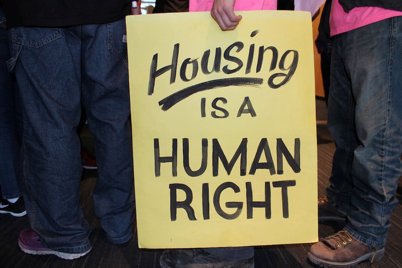 Protesters hold placards during a May 14