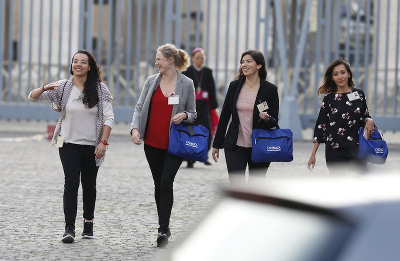Synod youth delegates arrive for a session of the Synod of Bishops on young people