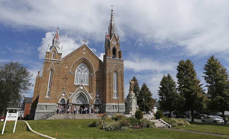 Worshippers leave Sainte-Agnes Church in Lac Megantic