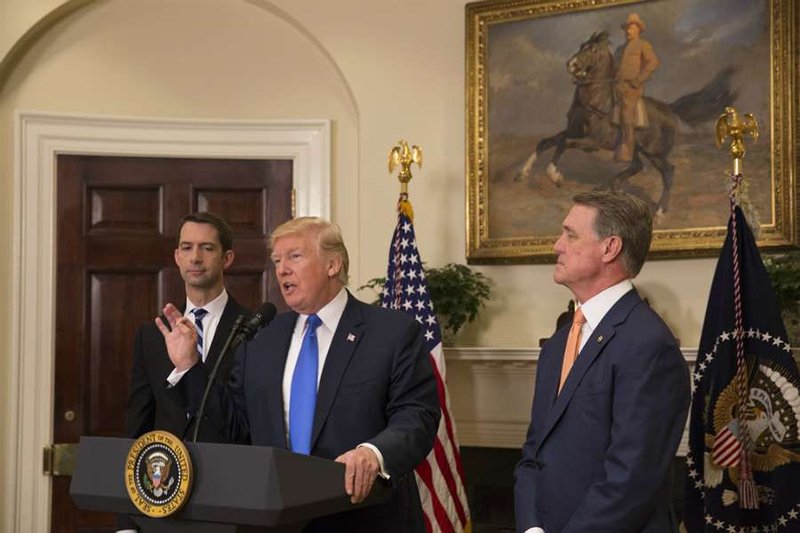 Trump announces introduction of the RAISE Act with Senator Tom Cotton (R Ark. left) and Senator David Perdue (R Ga.) at the White House