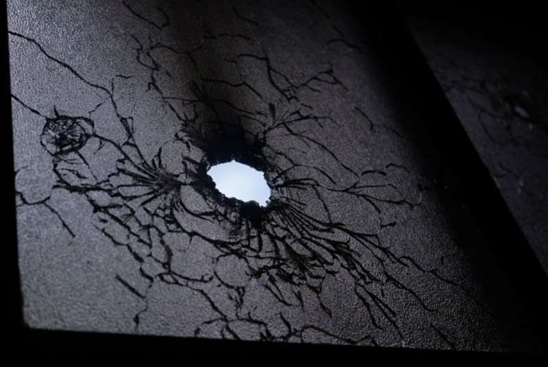 Bullet holes in the window of Divine Mercy church in Managua