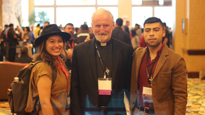 Bishop David O’Connell poses with Archdiocese of Los Angeles V Encuentro delegates Grace Rodriguez and Johnny Martinez. PABLO KAY/ANGELUS NEWS