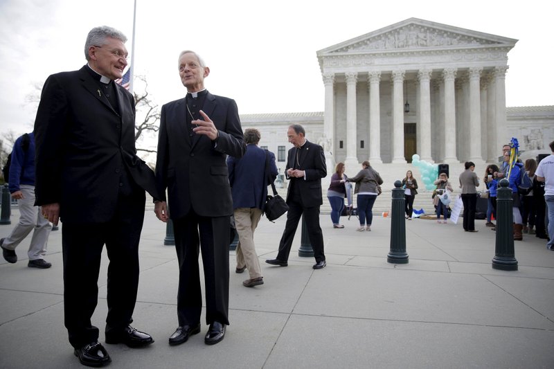 Bishop David A. Zubik of Pittsburgh and Cardinal Donald W. Wuerl of Washington are seen near the U.S. Supreme Court in Washington March 23. In its May 16 decision in the Zubik v. Burwell contraceptive mandate case